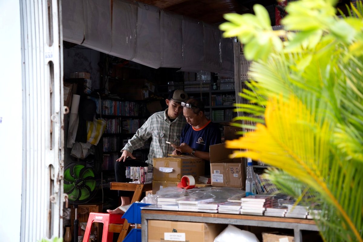 Two people working together in a stock-filled small-business space
